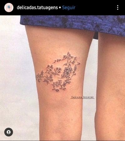 Tatuagem feminina na coxa: 132 melhores artes para você escolher