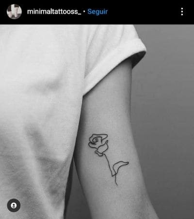Tatuagem minimalista de uma rosa feita em uma única linha.
